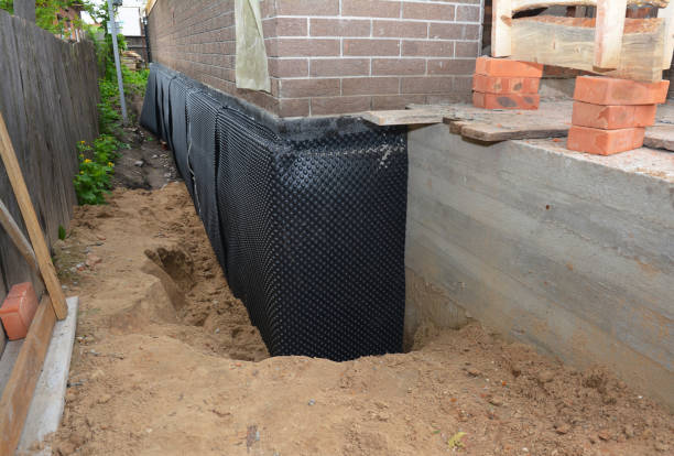 Happy homeowners after waterproofing job in Detroit